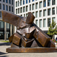 Modern geometric metal sculpture with sharp edges and sculptural depth.