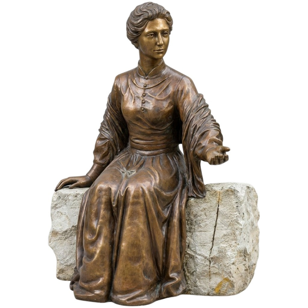 Bronze statue of Catherine McAuley seated on a bench with detailed period clothing