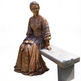 Bronze seated figure statue symbolizing compassion and historical significance