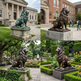 Regal bronze lion sculpture featuring intricate mane detailing and a powerful stance