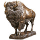 Bronze statue of a bison on a white background