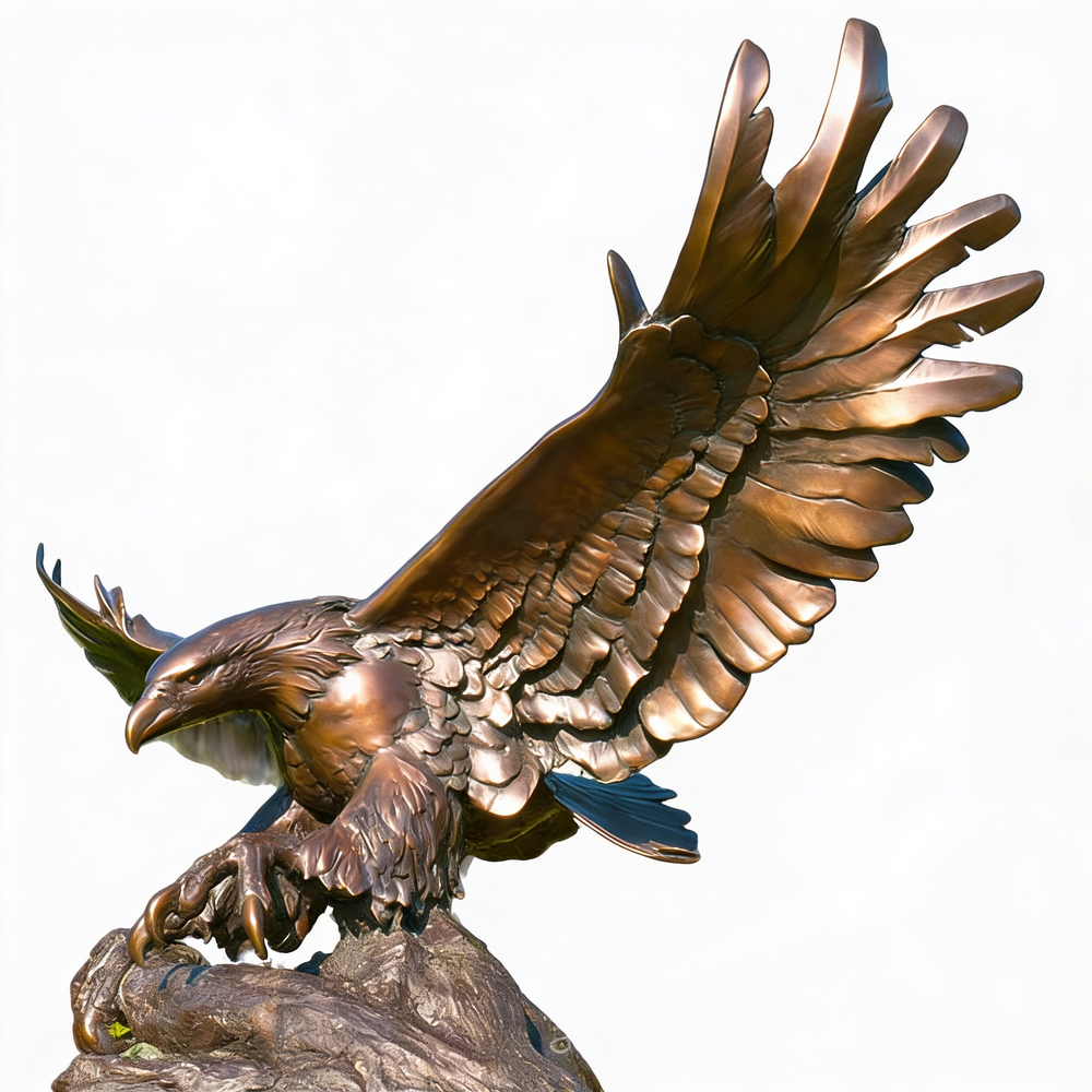 Bronze statue of an eagle with outstretched wings on a white background