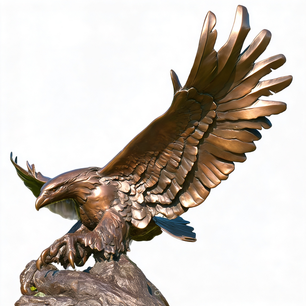 Bronze statue of an eagle with outstretched wings on a white background
Bronze eagle sculpture with wings fully spread and talons extended on rock base