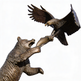 Bronze sculpture of a bear and an eagle interacting with a fish.