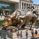 Bronze bull statue in front of a building with people around
Contemporary bull sculpture with aggressive stance and smooth bronze finish