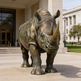 Bronze rhinoceros statue in front of a building
Sculpted metal rhinoceros artwork featuring intricate detailing and polished bronze finish