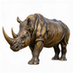 Bronze rhinoceros statue on a white background
Realistic bronze rhino sculpture capturing powerful stance and natural texture