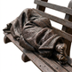 Wooden sculpture of a person lying on a bench with a blanket
Realistic bronze sculpture of a figure lying under a blanket on a bench