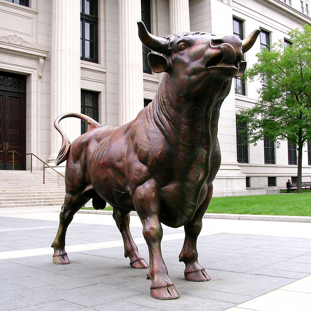 Bronze bull statue in front of a building with columns