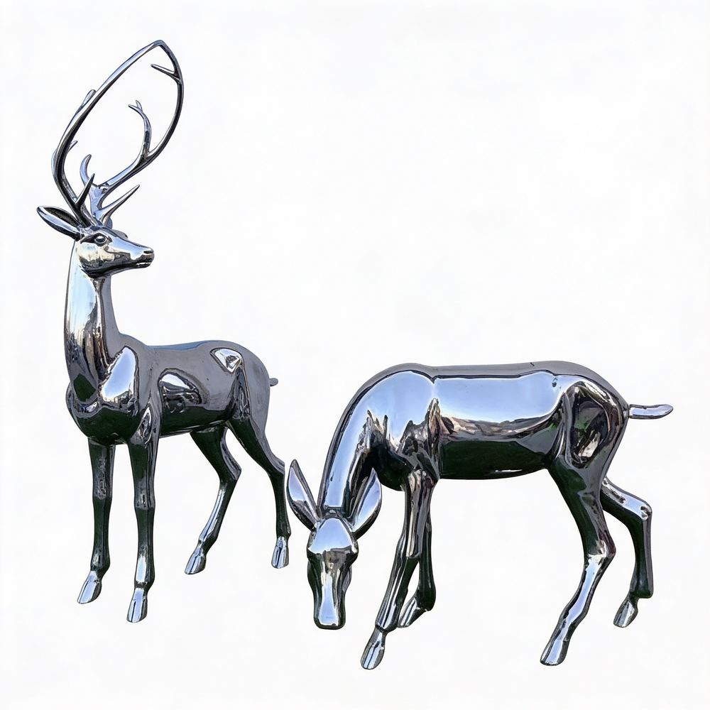 Two chrome deer figurines on a white background
Polished chrome deer sculpture set featuring a standing stag and grazing doe