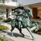 Bronze statue of a warrior on horseback in front of a building
Bronze Japanese warrior on horse with realistic musculature and motion