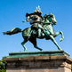 Statue of a samurai on horseback against a clear blue sky
Bronze samurai warrior on horseback sculpture with detailed armor