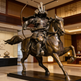 Bronze statue of a samurai on horseback in an indoor setting
Bronze artwork depicting an armored samurai on a rearing horse.