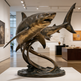 Bronze sculpture of a shark in an art gallery setting
Bronze marine sculpture depicting two sharks in motion