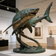 Bronze sculpture of a shark in an art gallery setting
Twin shark bronze artwork with realistic anatomy and textured surfaces