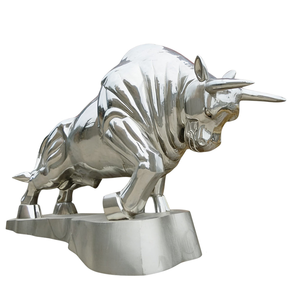 Metallic bull sculpture on a white background