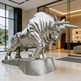 Metallic bull statue in a modern indoor setting