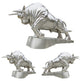 Set of three silver bull statues on a white background
Metal charging bull sculpture mounted on a matching base.
