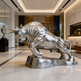 Metallic bull statue in a luxurious interior setting
Lifesize bull artwork with dynamic stance and shiny finish