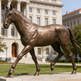 Bronze horse artwork featuring detailed anatomy and elegant walking stance