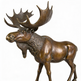 Bronze statue of a moose with large antlers on a white background