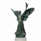 Bronze statue of an angel with outstretched wings on a white background