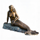 Bronze statue of a mermaid on a white background