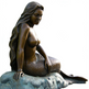 Bronze statue of a mermaid sitting on a rock