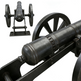 Close-up of a black cannon with wheels on a white background