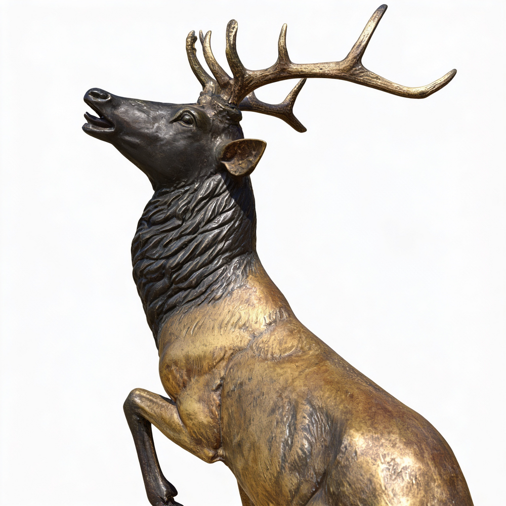 Naturalistic bronze stag sculpture with strong antlers and lifelike body proportions.
