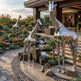 Metallic giraffe sculptures in a landscaped garden setting with a building in the background.
Shiny giraffe artwork set with realistic proportions and polished finish