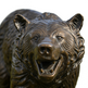 Bronze bear statue on a white background
