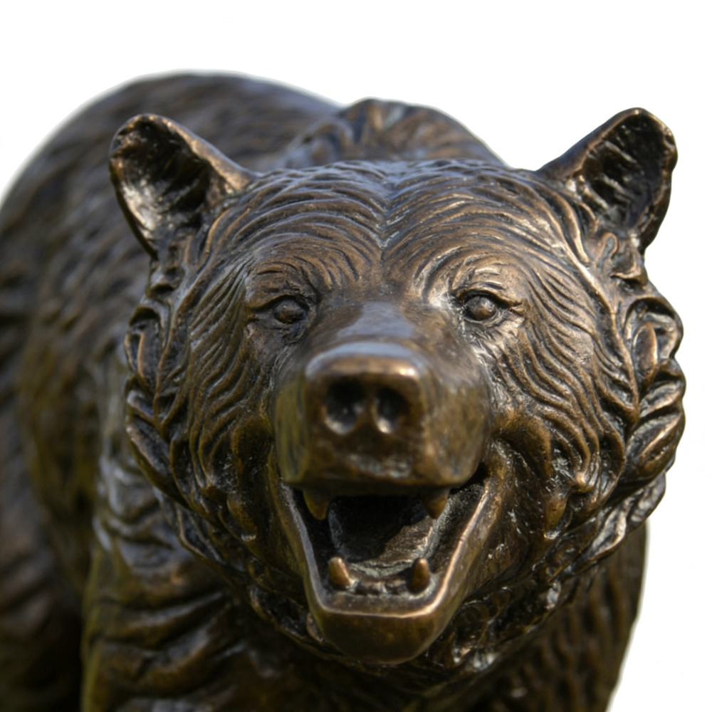 Bronze bear statue on a white background