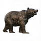 Bronze bear statue on a white background