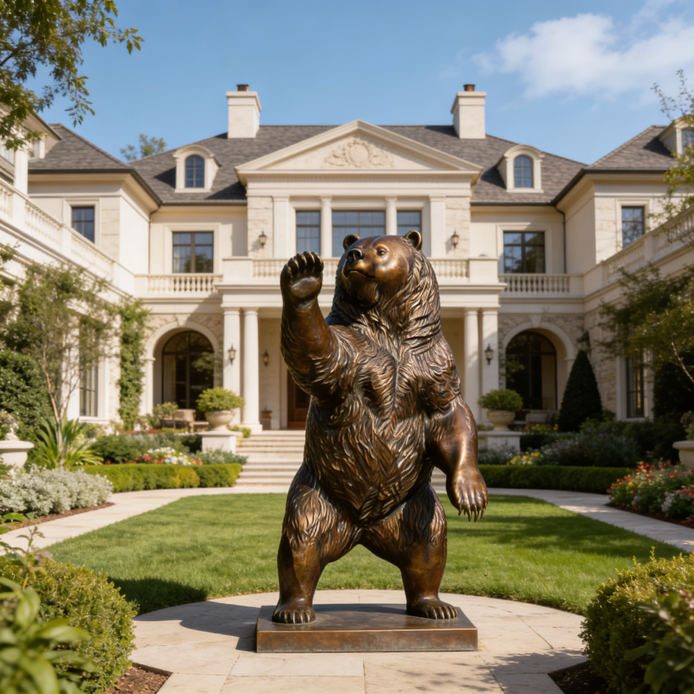 Bronze bear statue in front of a large mansion