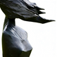 Black stone sculpture of a woman's bust with flowing hair on a white 
background

Modern artistic sculpture of a woman with flowing dress and stylized movement
