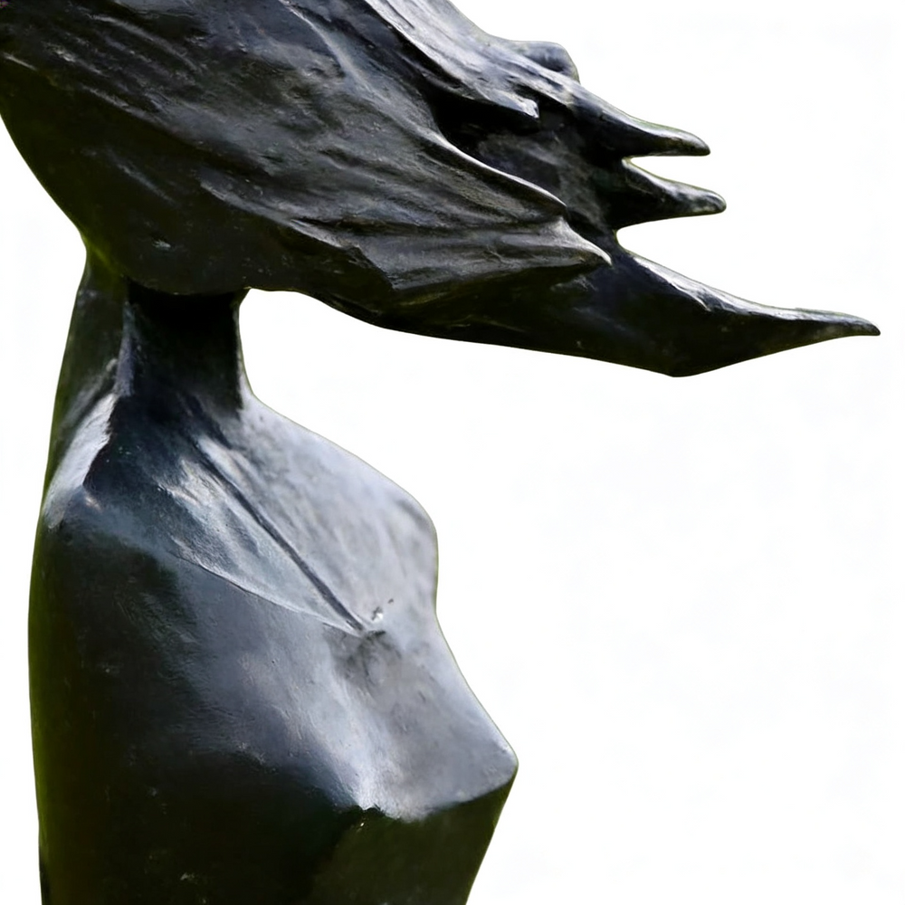 Black stone sculpture of a woman's bust with flowing hair on a white 
background

Modern artistic sculpture of a woman with flowing dress and stylized movement