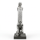 Silver sculpture of a seated figure with a standing figure behind on a white background