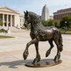 Bronze horse statue in front of a city building
Detailed bronze sculpture of a horse with lifelike anatomy and elegant motion