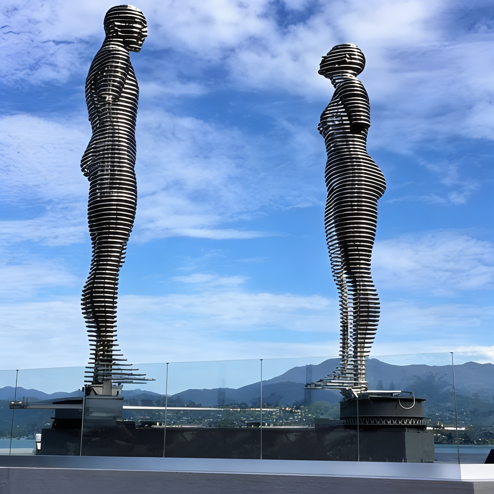 Modern abstract sculpture with two figures built from horizontal metal rings