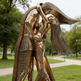 Bronze sculpture of a person playing guitar in a park setting
Modern abstract embrace sculpture with faceted surfaces and elongated human forms