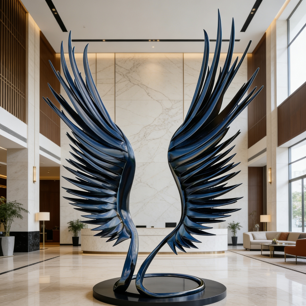 Large blue metal sculpture of wings in a modern indoor setting
