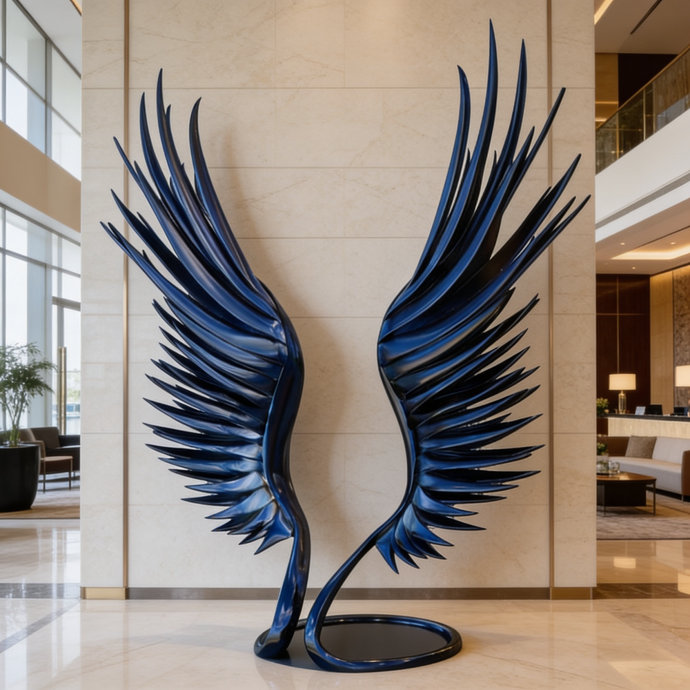 Large blue and black winged sculpture in a modern indoor setting