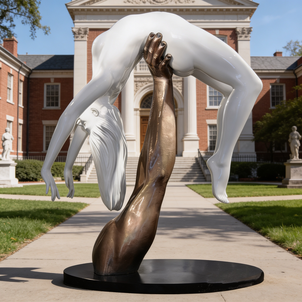 Expressive sculpture of a bronze arm elevating a smooth white figure, symbolizing support and motion