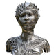 Metallic sculpture of a face with intricate patterns on a white background