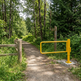 Welded steel construction detail of a commercial-grade yellow P-gate barrier post.