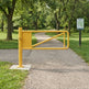 Manual locking swing barrier gate installed at a corporate facility entrance roadway