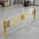 Yellow powder-coated manual swing gate securing an industrial perimeter driveway