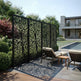 Laser cut tree pattern privacy panel with powder coated architectural finish