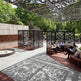 Modern metal privacy screen featuring intertwined branches and leaves